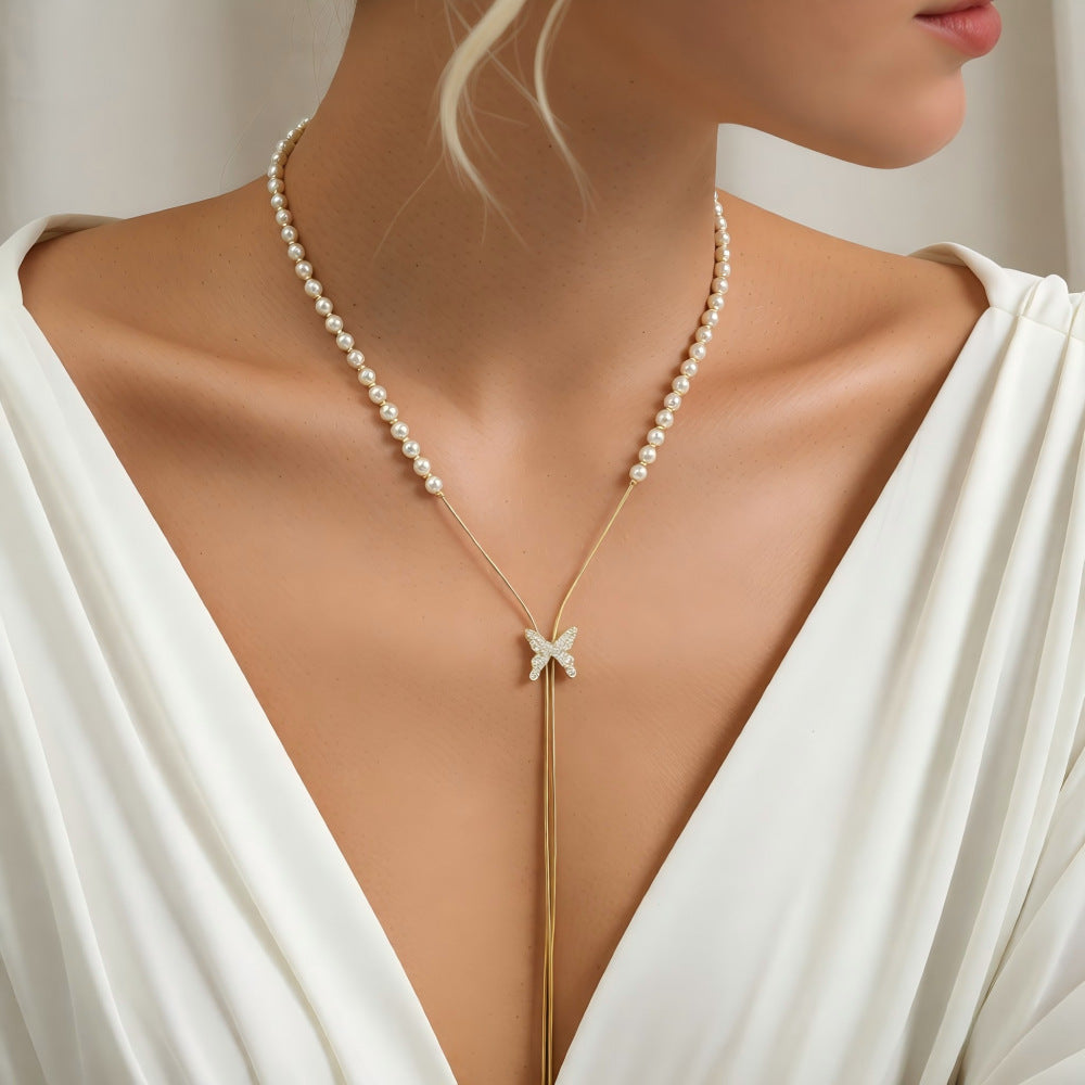 Long butterfly pearl necklace