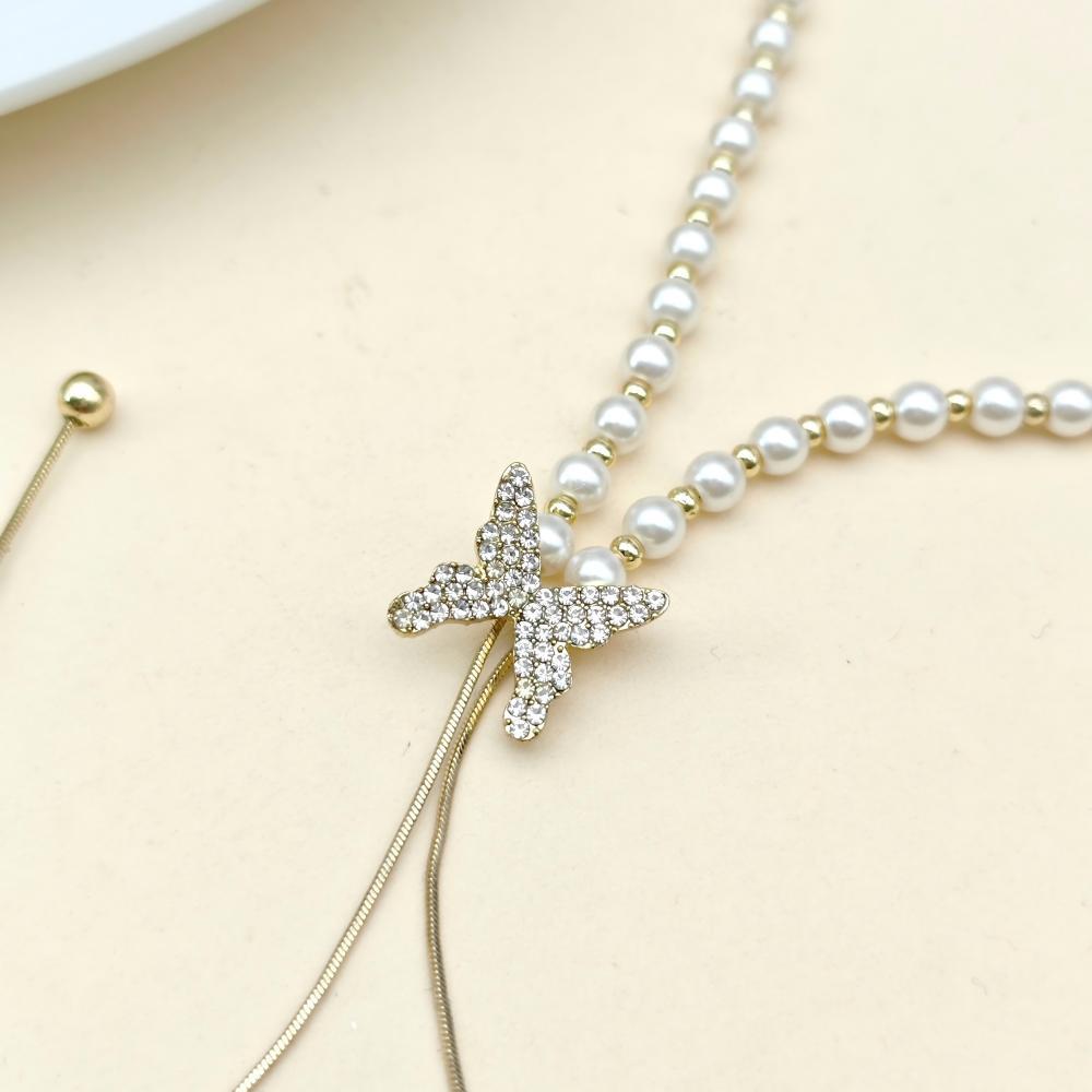 Long butterfly pearl necklace