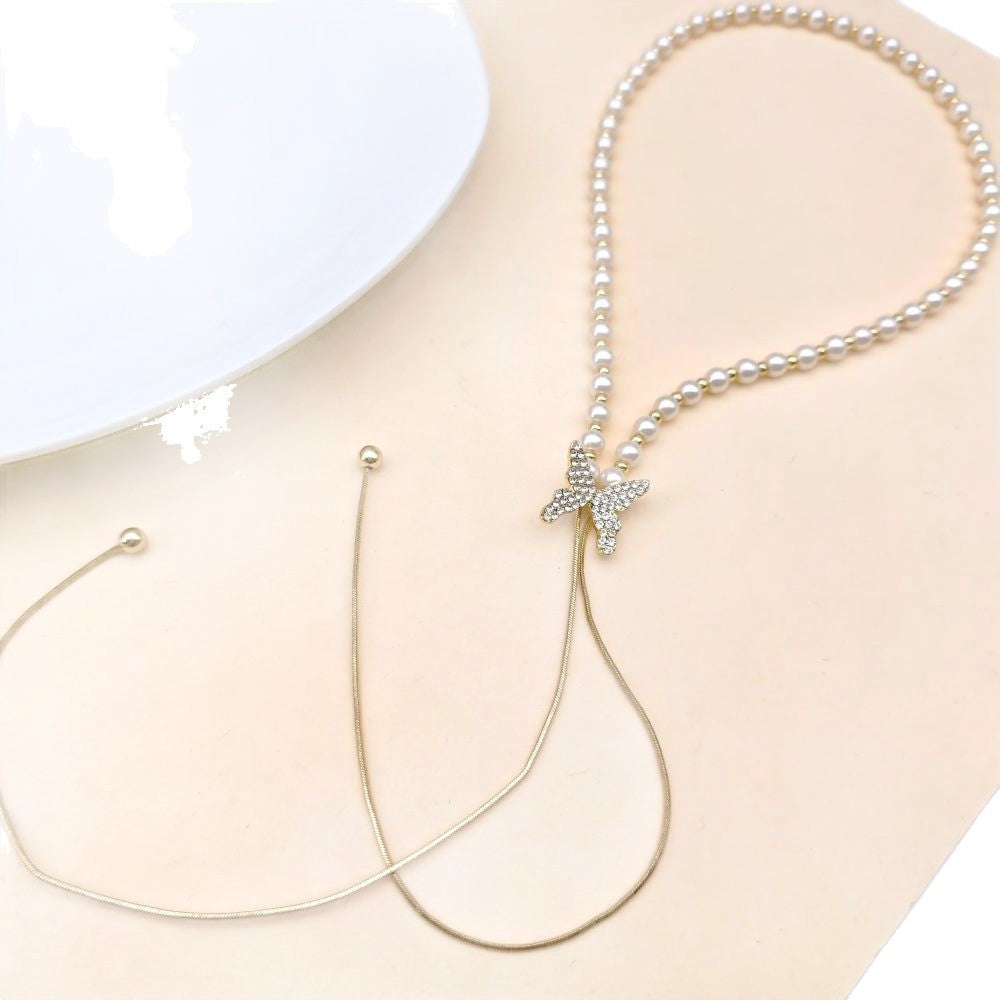 Long butterfly pearl necklace